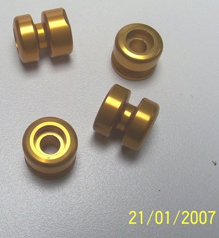 Race stand bobbins anodised gold.jpg
