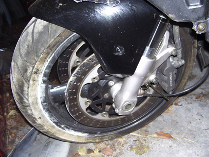 Scratched and slightly bent disc. rim is scratched, but straight.