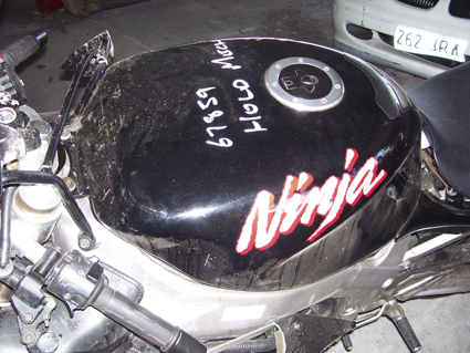 Mangled fairing stay bracket. Tank's good though!