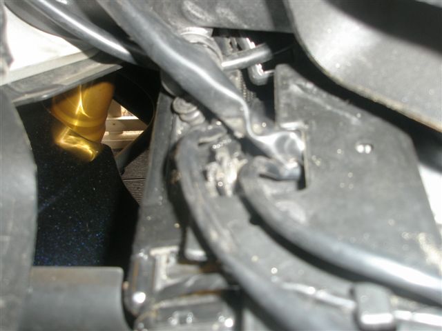 Wiring running under plastic guard instead of over. No clip to hold.