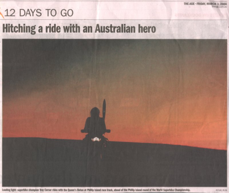 Troy Corser and the Comm games baton at PI